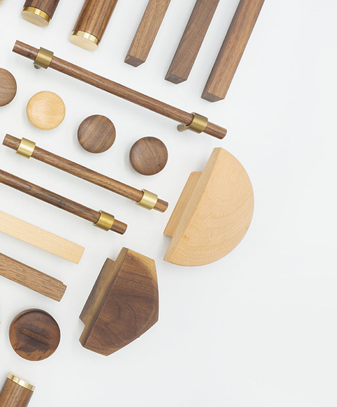 Assortment of finely crafted wooden drawer handles and knobs from UNTOLDstr's natural wood hardware collection.