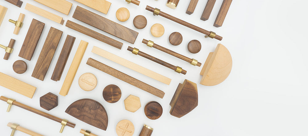 Assortment of finely crafted wooden drawer handles and knobs from UNTOLDstr's natural wood hardware collection.